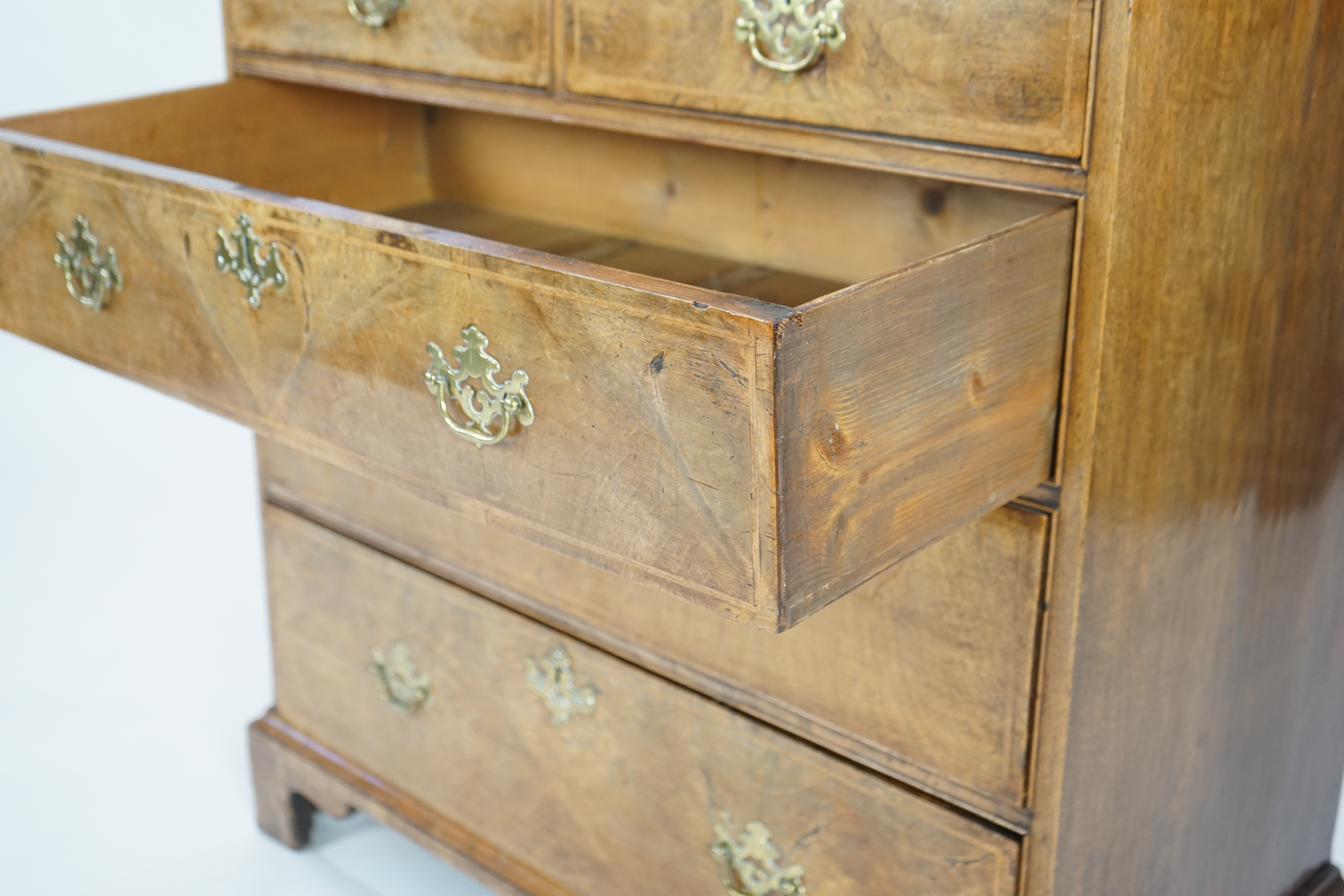 A George II walnut and feather banded caddy top chest